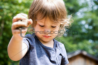 toddler playing with sand