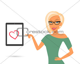 Blonde woman showing something displayed on tablet pc