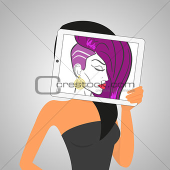 Woman holds tablet pc displaying fashion drawing.