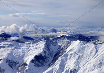 Winter mountains in mist at windy day