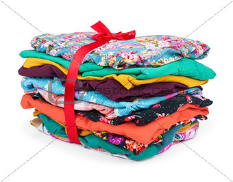 Big heap of colorful clothes, isolated on white background.
