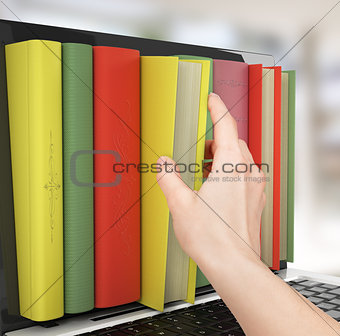 Laptop and colorful book. education