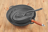 cast iron frying pan on a wooden background