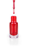 red nail polish with a drop on an isolated white background