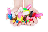 Multi-colored jelly sweets in the hands with a bright nail polish