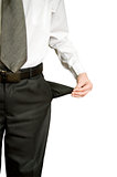 businessman standing isolated on the white background and showing his empty pocket, turning his pocket inside out, no money