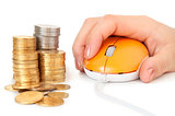computer mouse in hand and heap of coins