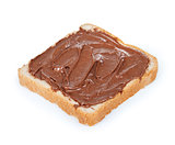 baguette slice spread with nut-choco paste, isolated on white