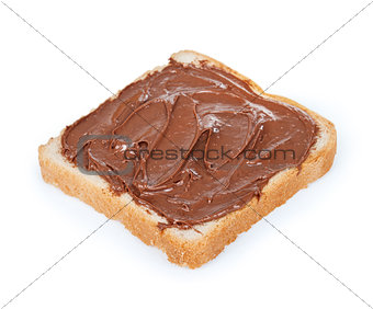 baguette slice spread with nut-choco paste, isolated on white