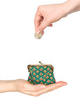 purse in hand and hand put coin in it isolated on white