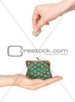 purse in hand and hand put coin in it isolated on white