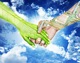 Nature and electronics holding hands in sky background