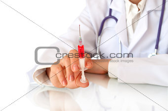 syringe in hand of doctor