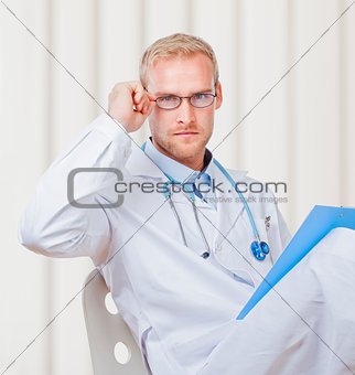 Portrait of a Young Doctor with Stethoscope and Glasses 