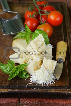 fresh tasty hard parmesan cheese on a wooden board