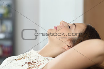 Woman relaxing and sleeping on the couch at home
