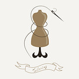 Tailoring emblem with mannequin or dummy and banner and threaded needle