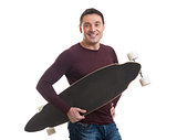 Happy smiling man holding longboard in his hand