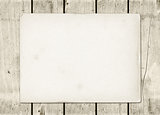 Blank vintage paper sheet on a white wood board