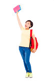 asian young student girl raising a hand with book