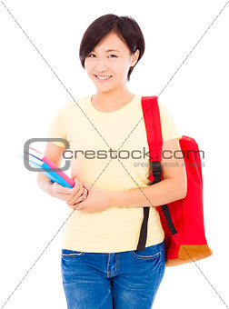 beautiful university student girl standing and holding book