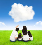 happy family on a meadow with cloud background