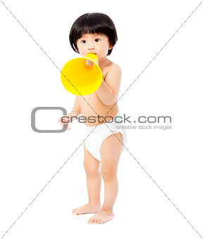 cute baby girl standing and holding a megaphone.