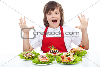 Happy chef with creative food creature sandwiches
