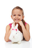 Little girl with her adorable white rabbit