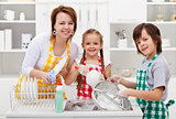 Kids helping their mother in the kitchen