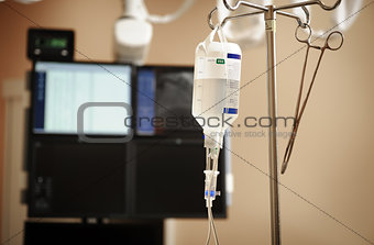 Intravenous drip system on a background of medical appliances