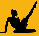 Black silhouette of ballerina isolated over yellow background