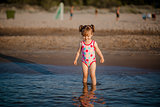 Adorable baby girl in the sea
