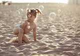 Adorable baby girl on the beach