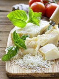 fresh tasty hard parmesan cheese on a wooden board