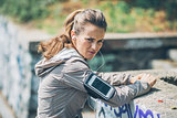 Portrait of serious fitness young woman outdoors