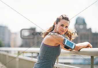 Portrait of fitness young woman in the city