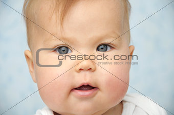 Adorable Baby child with chubby cheeks portrait