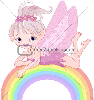 Pixie fairy on rainbow
