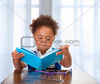 Little schoolboy read book