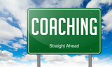 Coaching on Green Highway Signpost.