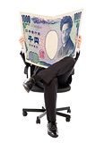 Business man sitting on a chair with japan currency in hands