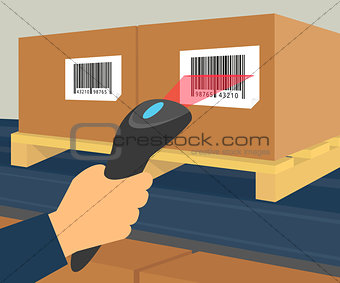 Human hand is scanning a box with barcode