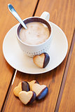 Cup of coffee and heart shaped biscuits