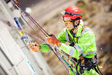 Industrial climber on a building during winterization works