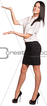 Beautiful businesswomen standing and showing empty palms