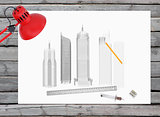 Architectural drawing and office supplies on the background of wooden boards