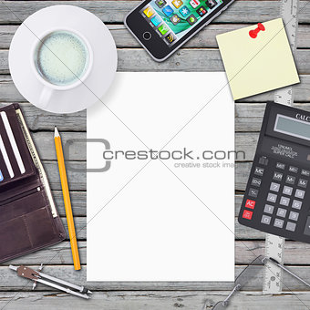 Desk businessman. Chancellery, white sheet and smartphone