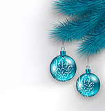 Hanging Christmas glass balls on fir twigs