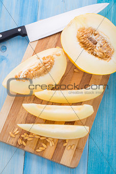 Melon slices on a cutting board
